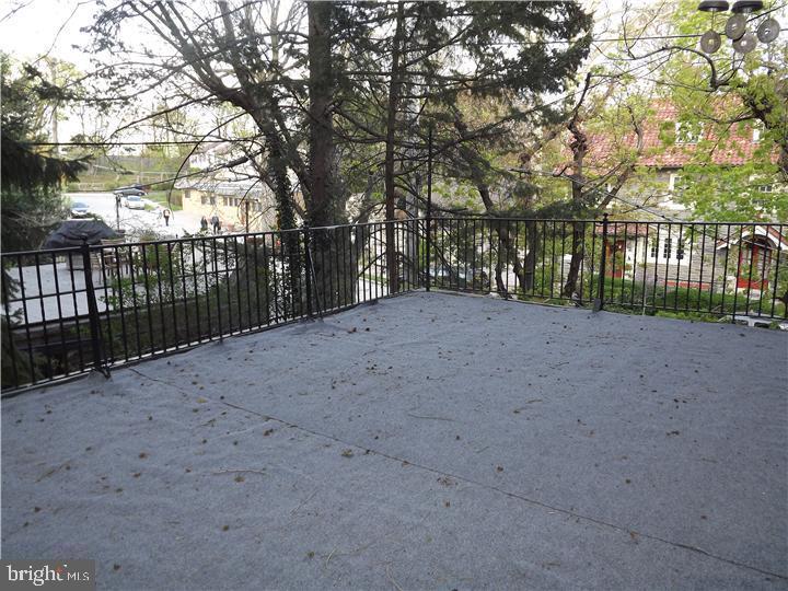 7905 Ardleigh Street, Unit 2 Philadelphia, PA 19118 - Photo 7 of 7 a view of a backyard with trees