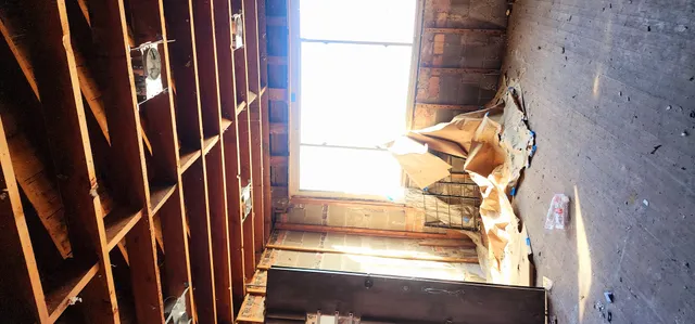 a view of staircase with wooden walls