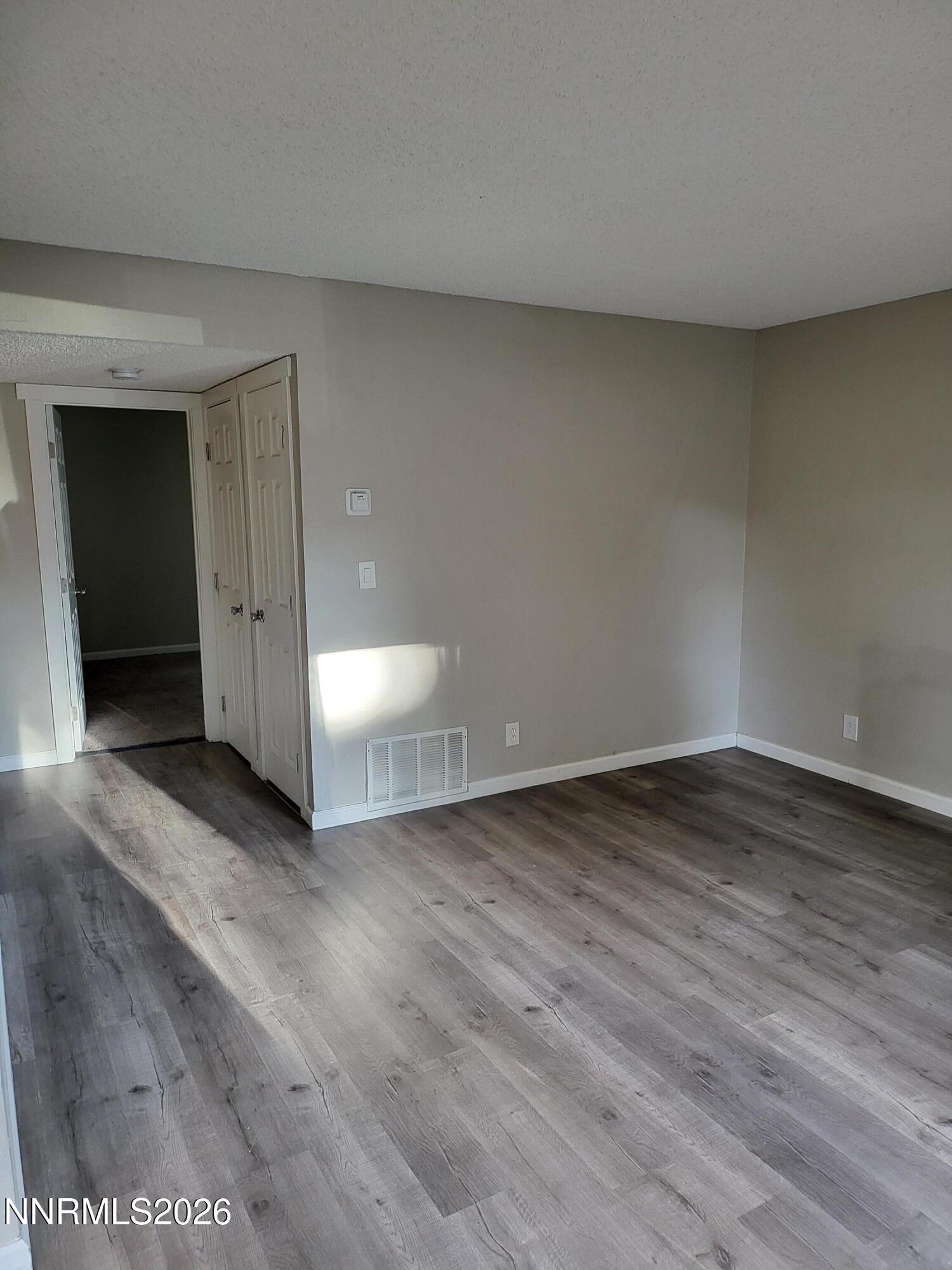 4606 Neil Road, Unit 197 Reno, NV 89502 - Photo 11 of 26 a view of a room with wooden floor