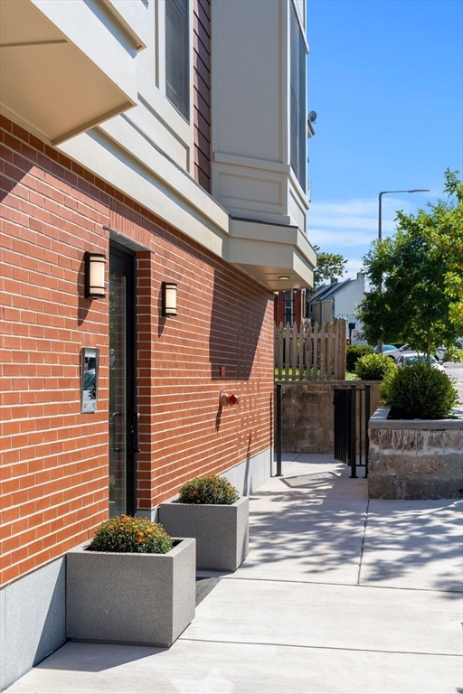 124 Warren Street, Unit 202 Boston, MA 02119 - Photo 21 of 23 a view of a terrace with sitting area