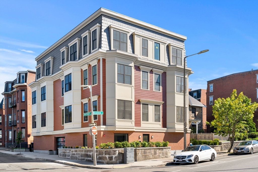 124 Warren Street, Unit 202 Boston, MA 02119 - Photo 22 of 23 a front view of a building with street view