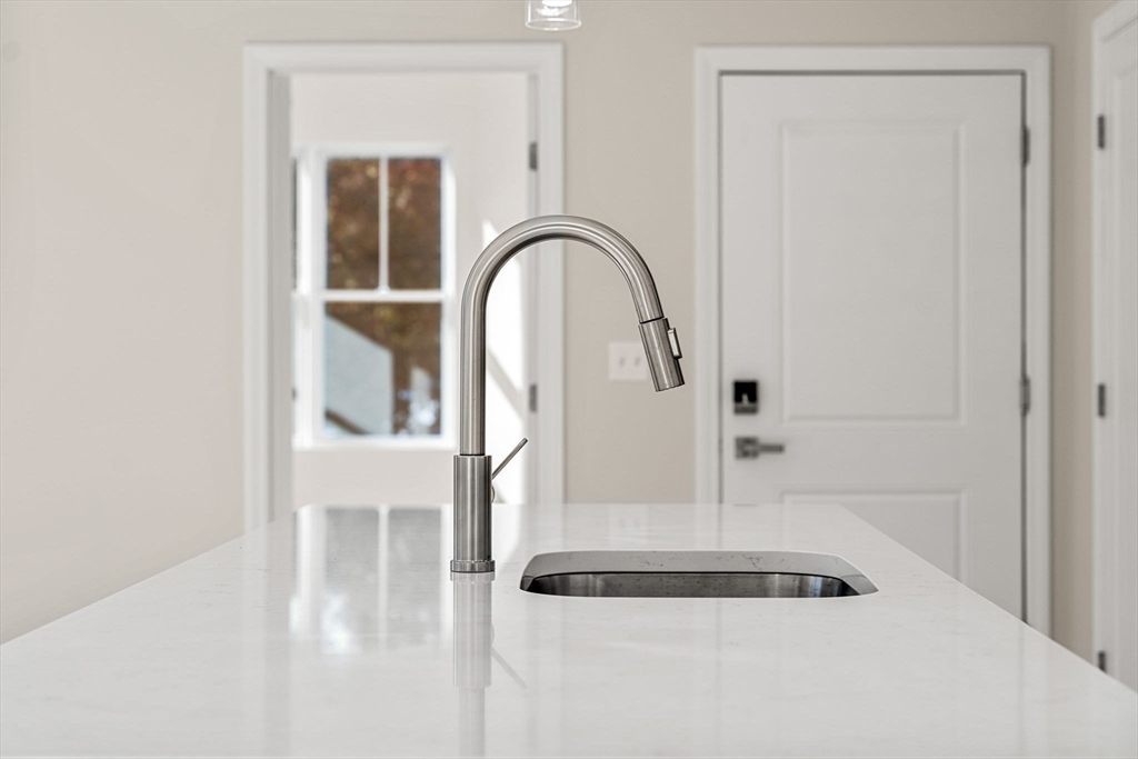 124 Warren Street, Unit 202 Boston, MA 02119 - Photo 7 of 23 a picture of a bathroom with mirror