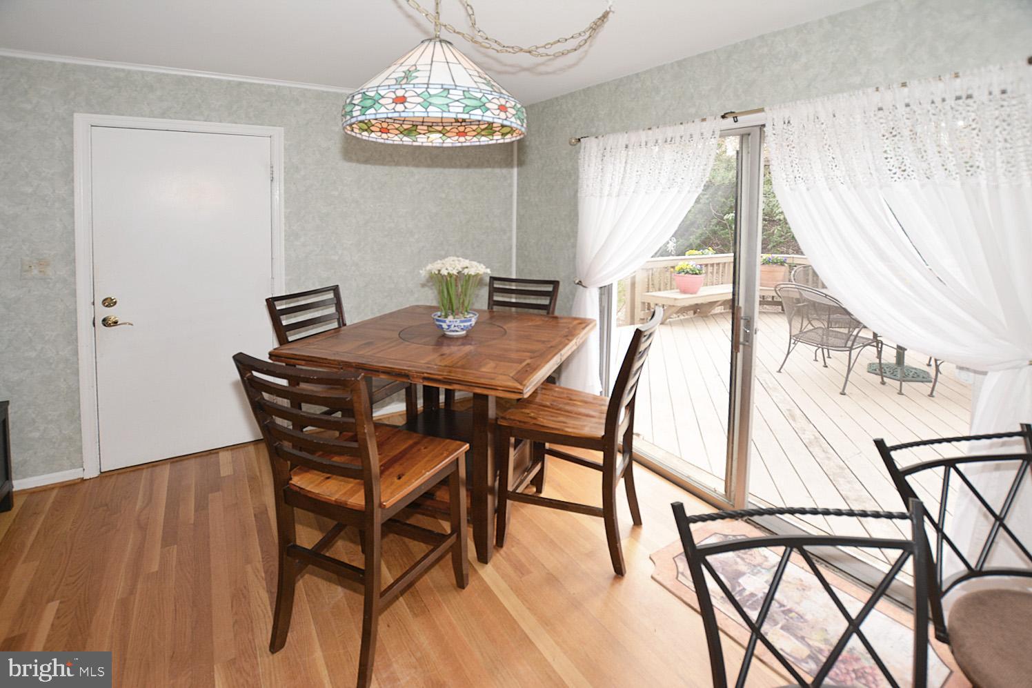 6906 Spur Road Springfield, VA 22153 - Photo 8 of 28 a view of a dining room with furniture and chandelier