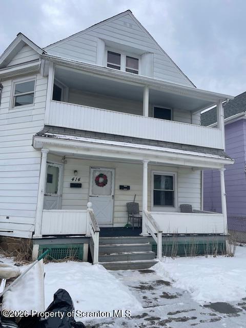 a view of a white house with a outdoor space