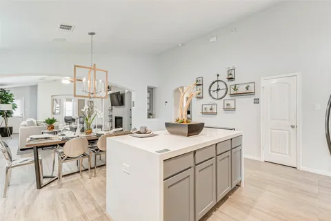 a view of living room with granite countertop furniture and fireplace