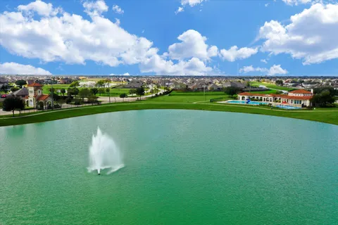 a view of a lake with a city