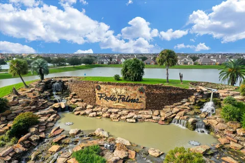 a view of a lake with houses in the back