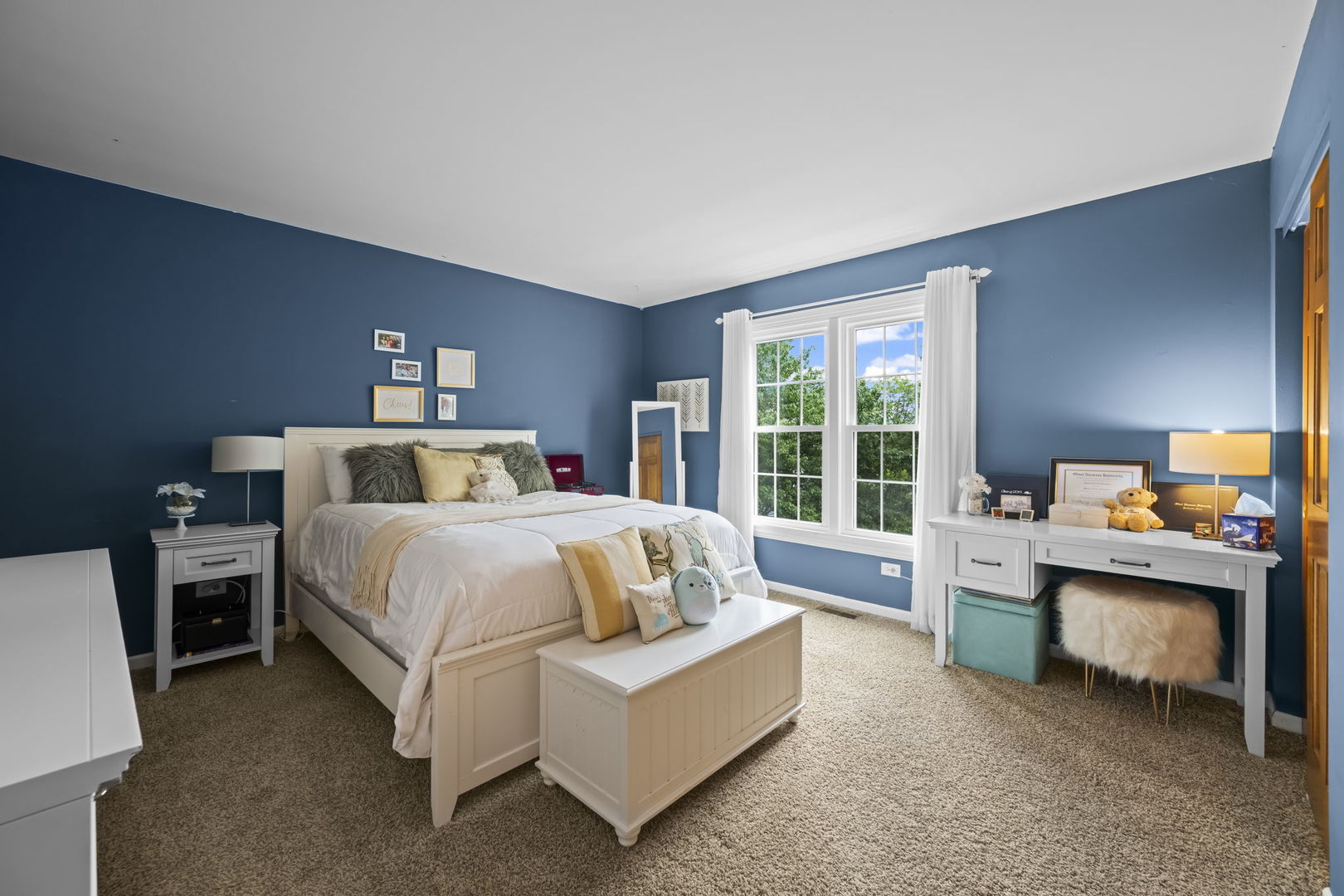 1565 Freeman Road Hoffman Estates, IL 60192 - Photo 32 of 46 a spacious bedroom with a bed and a large window