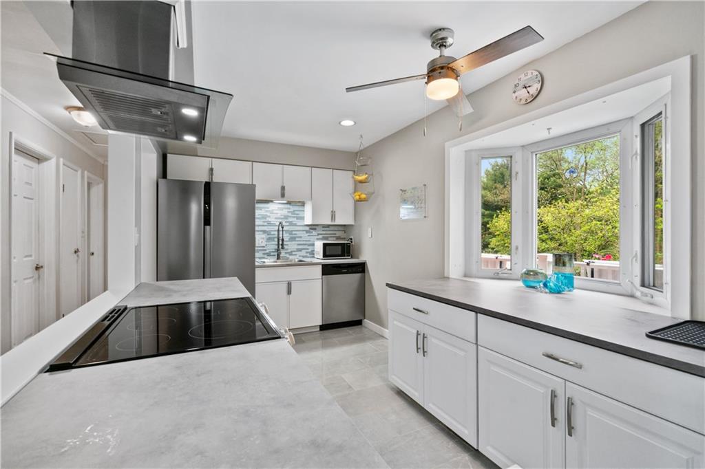 5431 Hamilton Road Gibsonia, PA 15044 - Photo 11 of 28 a kitchen with granite countertop a sink stainless steel appliances and window
