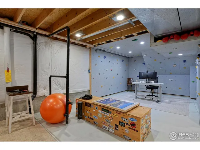 a view of a livingroom with furniture and a flat screen tv