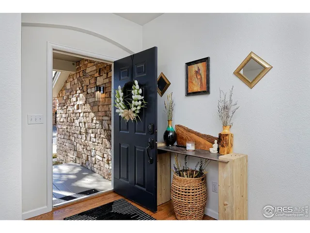 a living room with furniture rug and window