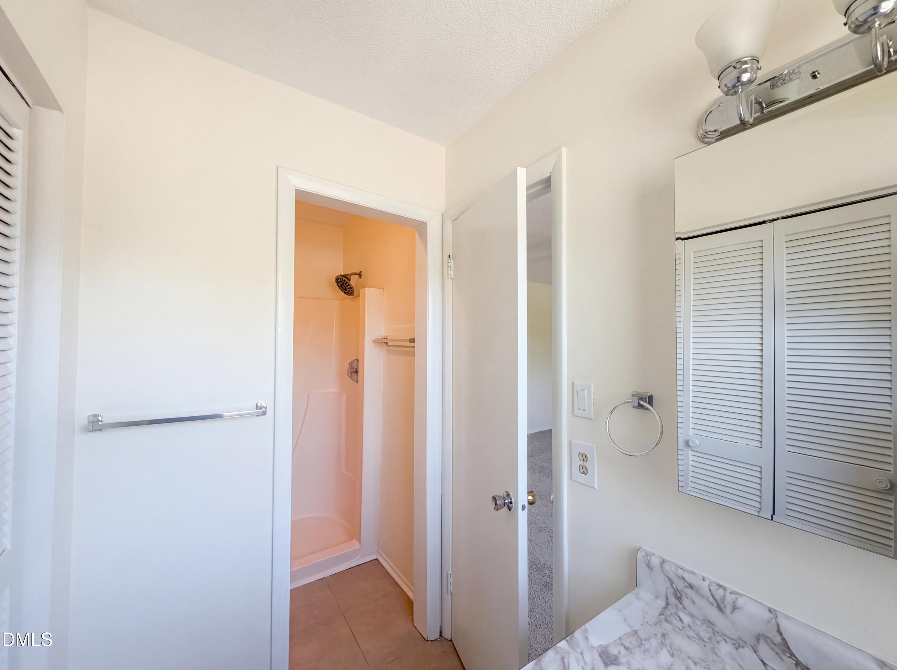 1220 Manassas Court, Unit B Raleigh, NC 27609 - Photo 26 of 32 a view of a bathroom with a sink and a toilet