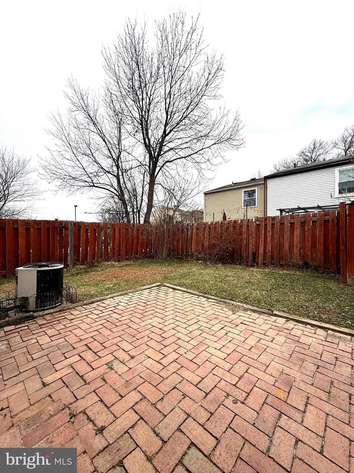 19445 Breezedale Lane Germantown, MD 20876 - Photo 15 of 16 a view of a backyard with wooden fence