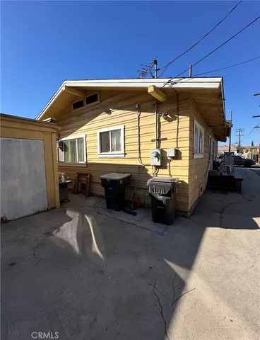 a table and chairs in front of a building