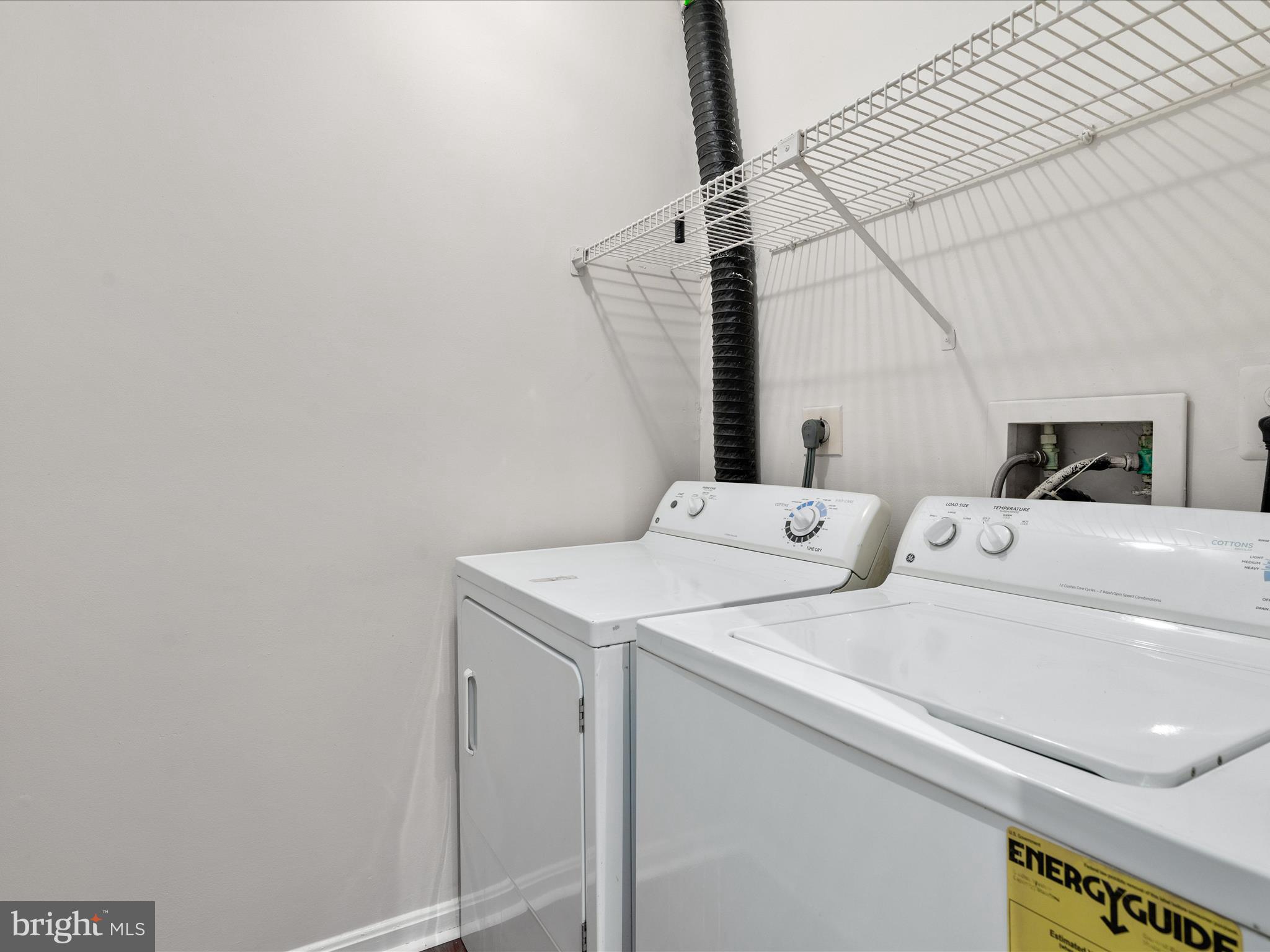 18334 Streamside Drive, Unit 101 Gaithersburg, MD 20879 - Photo 14 of 29 a utility room with dryer and washer