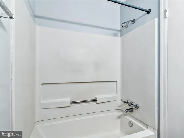 a bathroom with a white bath tub
