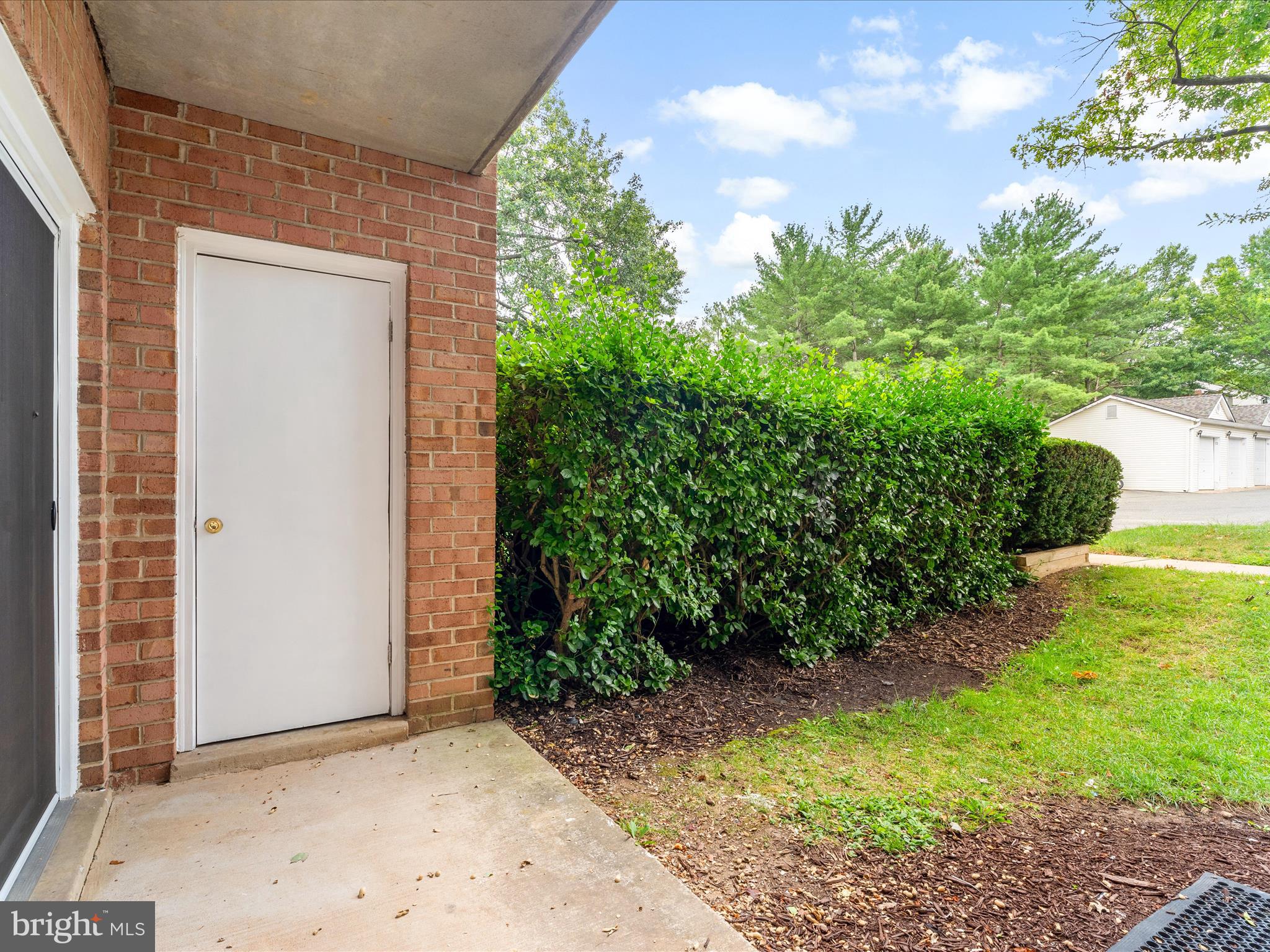 18334 Streamside Drive, Unit 101 Gaithersburg, MD 20879 - Photo 22 of 29 a view of backyard with garden