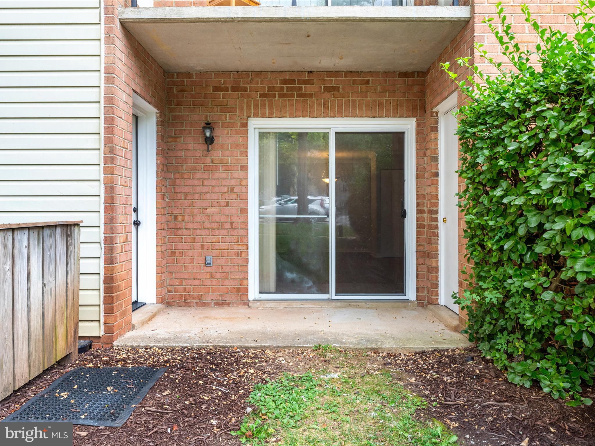18334 Streamside Drive, Unit 101 Gaithersburg, MD 20879 - Photo 24 of 29 a front view of a house with a blue gate