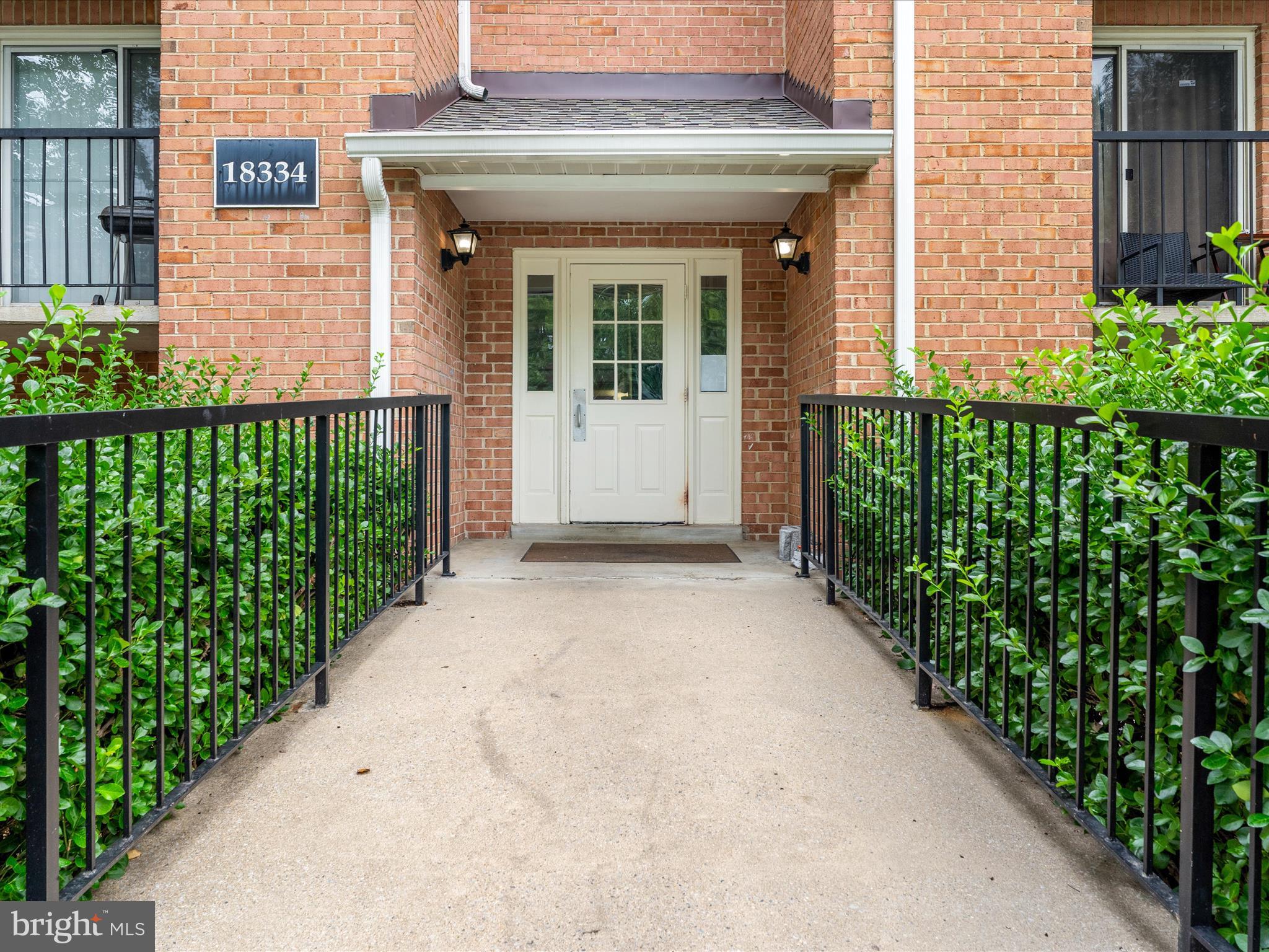18334 Streamside Drive, Unit 101 Gaithersburg, MD 20879 - Photo 25 of 29 a view of a house with potted plants