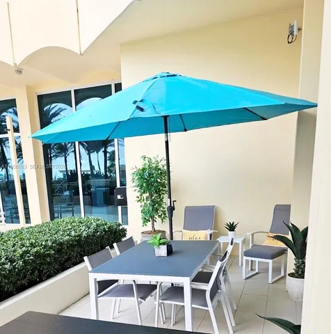 a table and chairs in front of a building