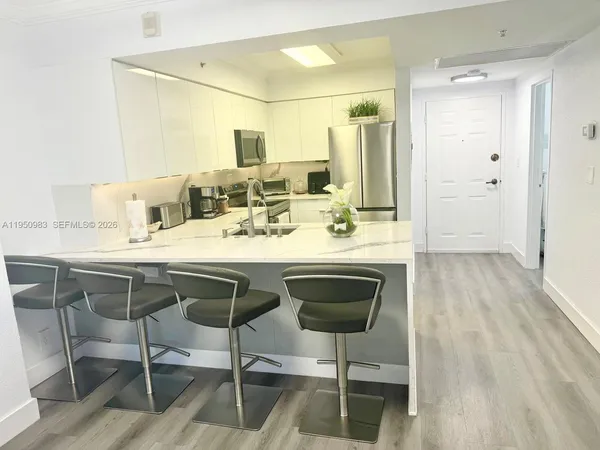 a dining room with a table and chairs
