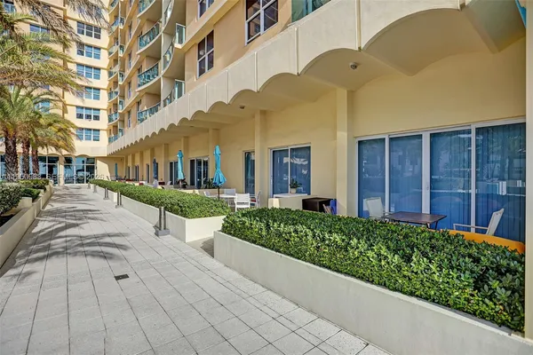 a view of a building with a garden