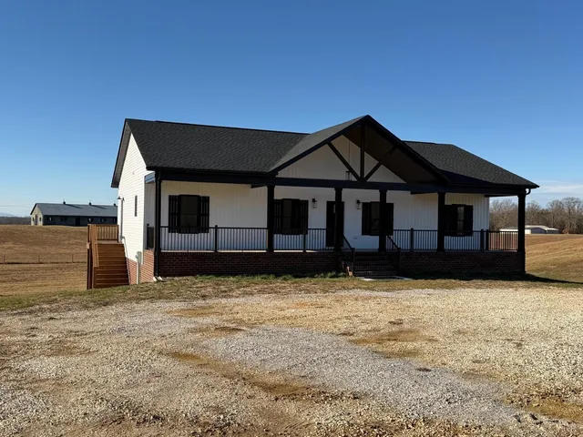 a house with a large tree in front of it