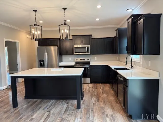 a kitchen with a sink refrigerator and microwave