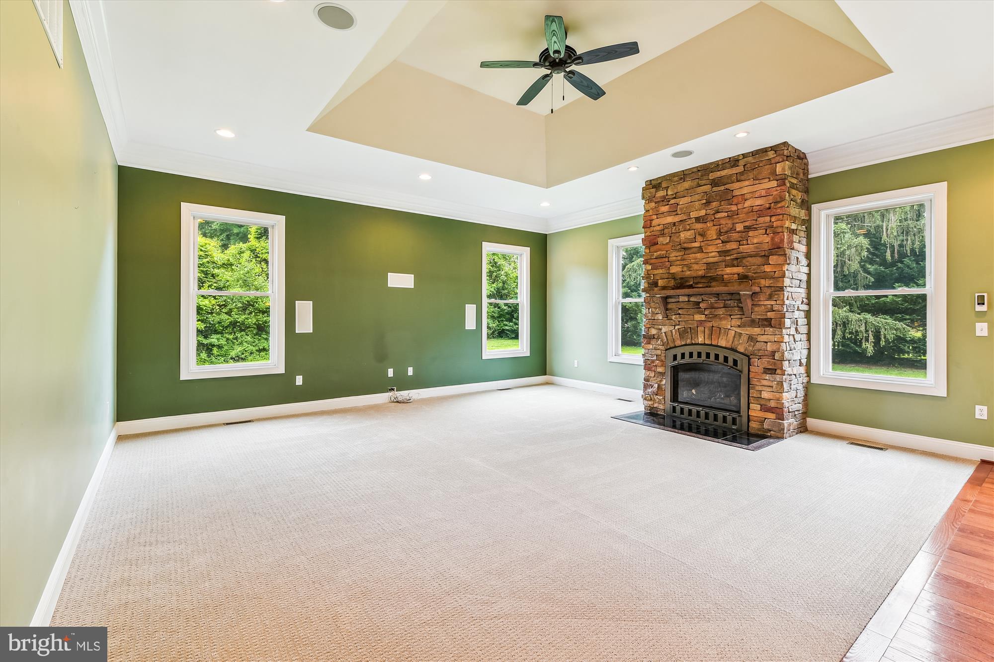 222 Wicklow Road Glen Burnie, MD 21061 - Photo 14 of 39 a view of an empty room with a fireplace and a window