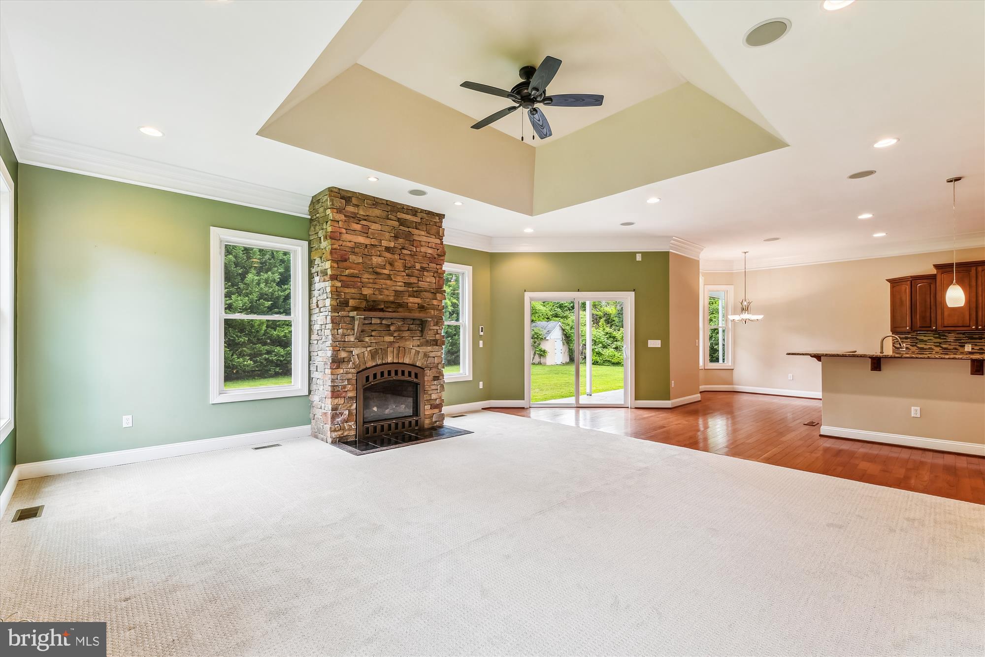 222 Wicklow Road Glen Burnie, MD 21061 - Photo 15 of 39 a view of an empty room with a fireplace and a chandelier