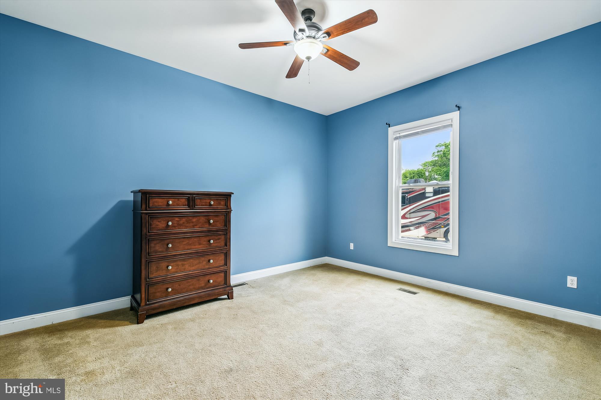 222 Wicklow Road Glen Burnie, MD 21061 - Photo 23 of 39 an empty room with windows and ceiling fan