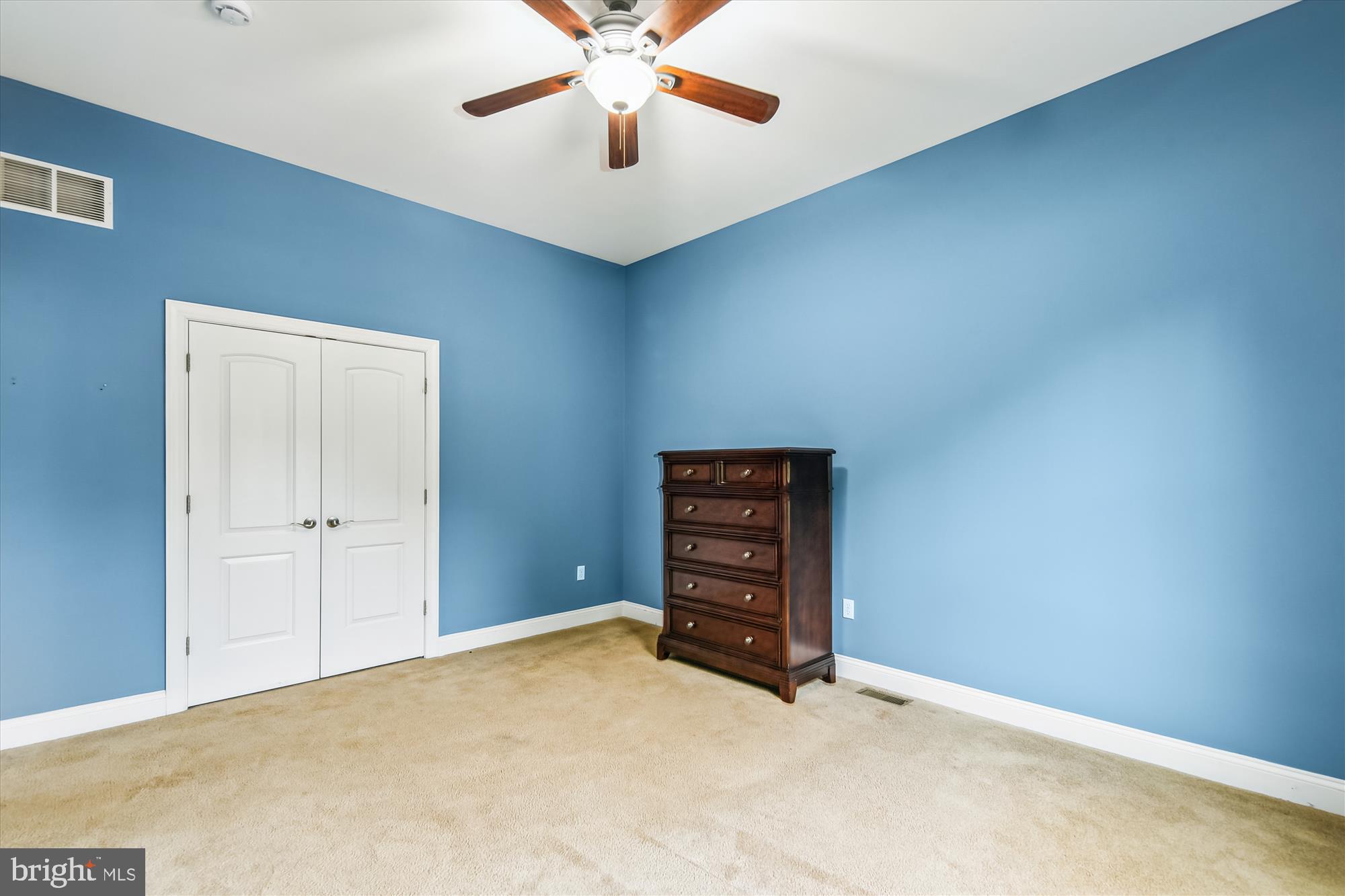 222 Wicklow Road Glen Burnie, MD 21061 - Photo 24 of 39 an empty room with a ceiling fan and closet