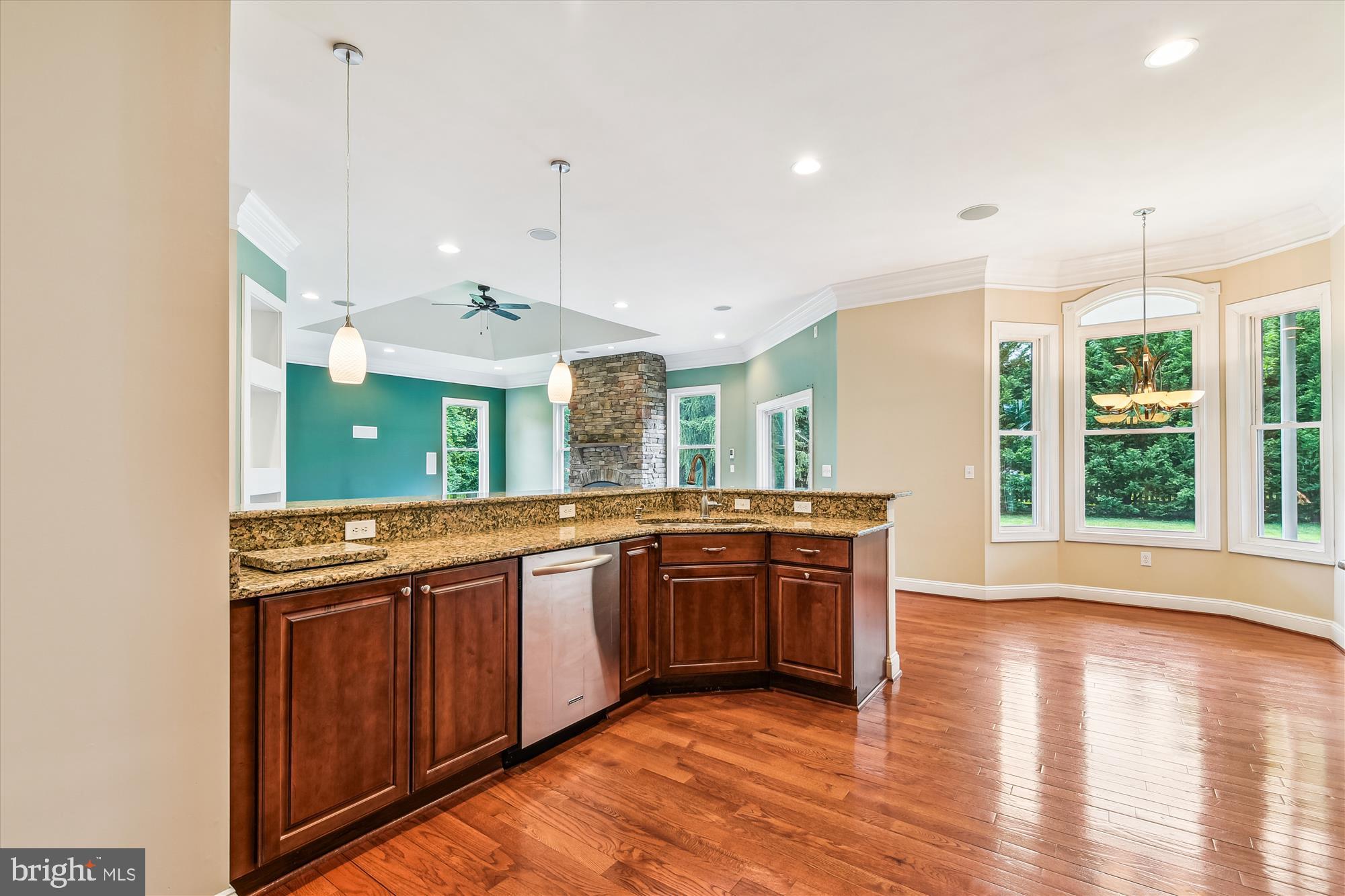 222 Wicklow Road Glen Burnie, MD 21061 - Photo 6 of 39 a large kitchen with stainless steel appliances granite countertop a stove and a wooden floors