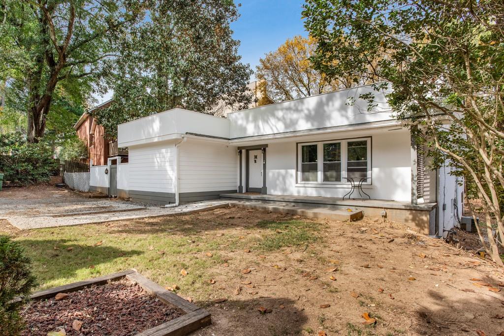 4513 Wieuca Road Northeast Atlanta, GA 30342 - Photo 1 of 1 a house that has a tree in front of it
