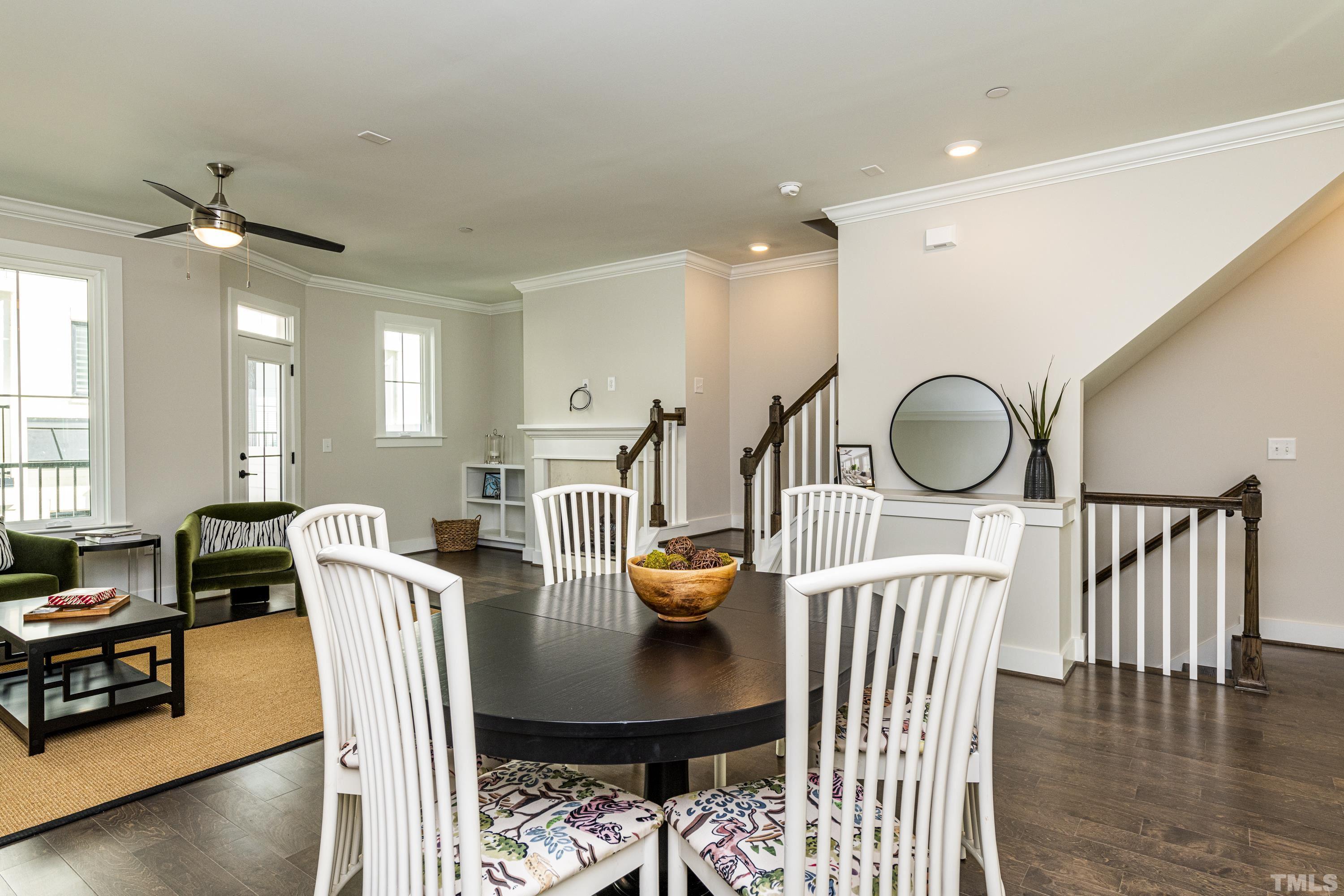 401 Bryan Pointe Drive, Unit 102 Raleigh, NC 27608 - Photo 13 of 30 a dining room with furniture and wooden floor