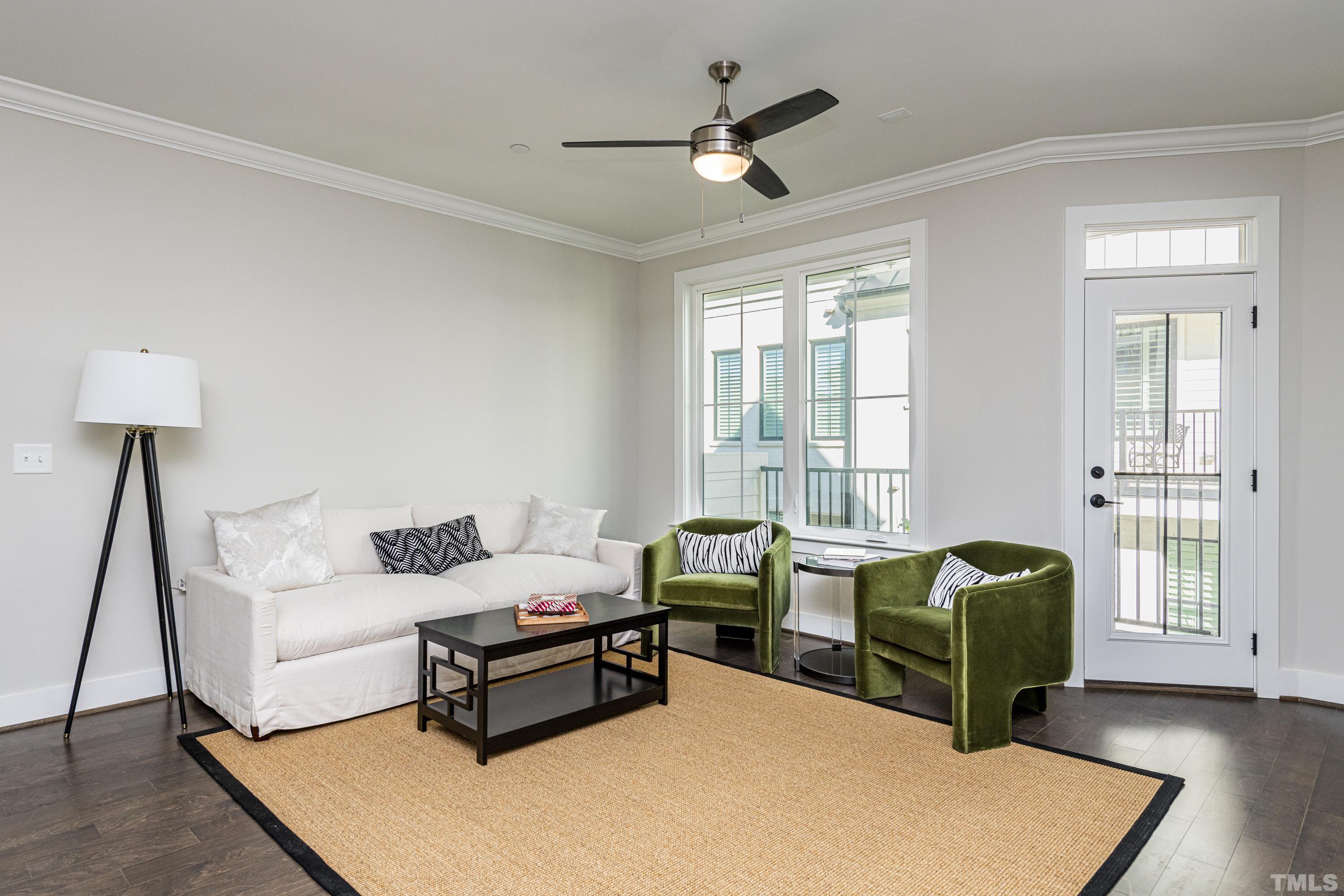 401 Bryan Pointe Drive, Unit 102 Raleigh, NC 27608 - Photo 14 of 30 a living room with furniture and a window