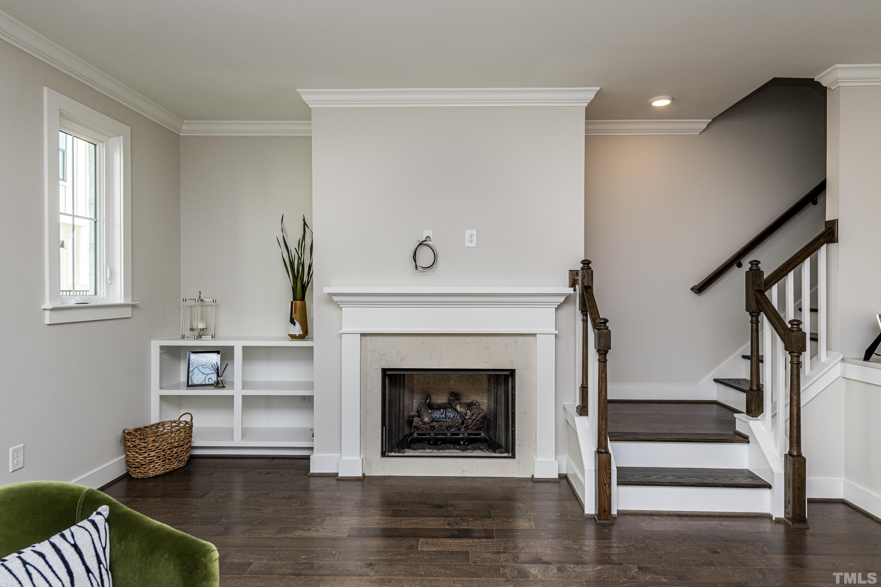401 Bryan Pointe Drive, Unit 102 Raleigh, NC 27608 - Photo 16 of 30 a living room with furniture and a fireplace