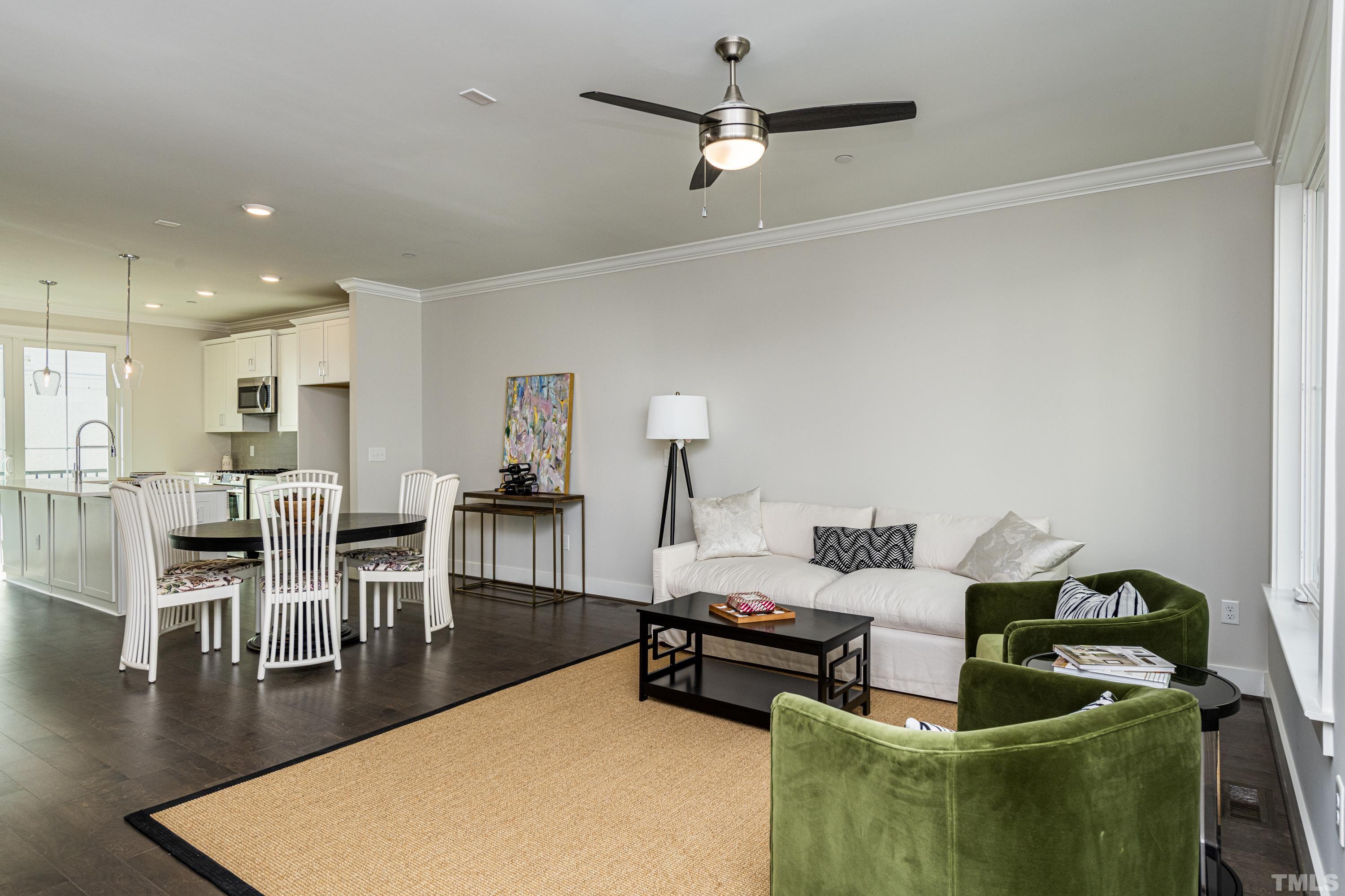 401 Bryan Pointe Drive, Unit 102 Raleigh, NC 27608 - Photo 18 of 30 a living room with furniture and a wooden floor