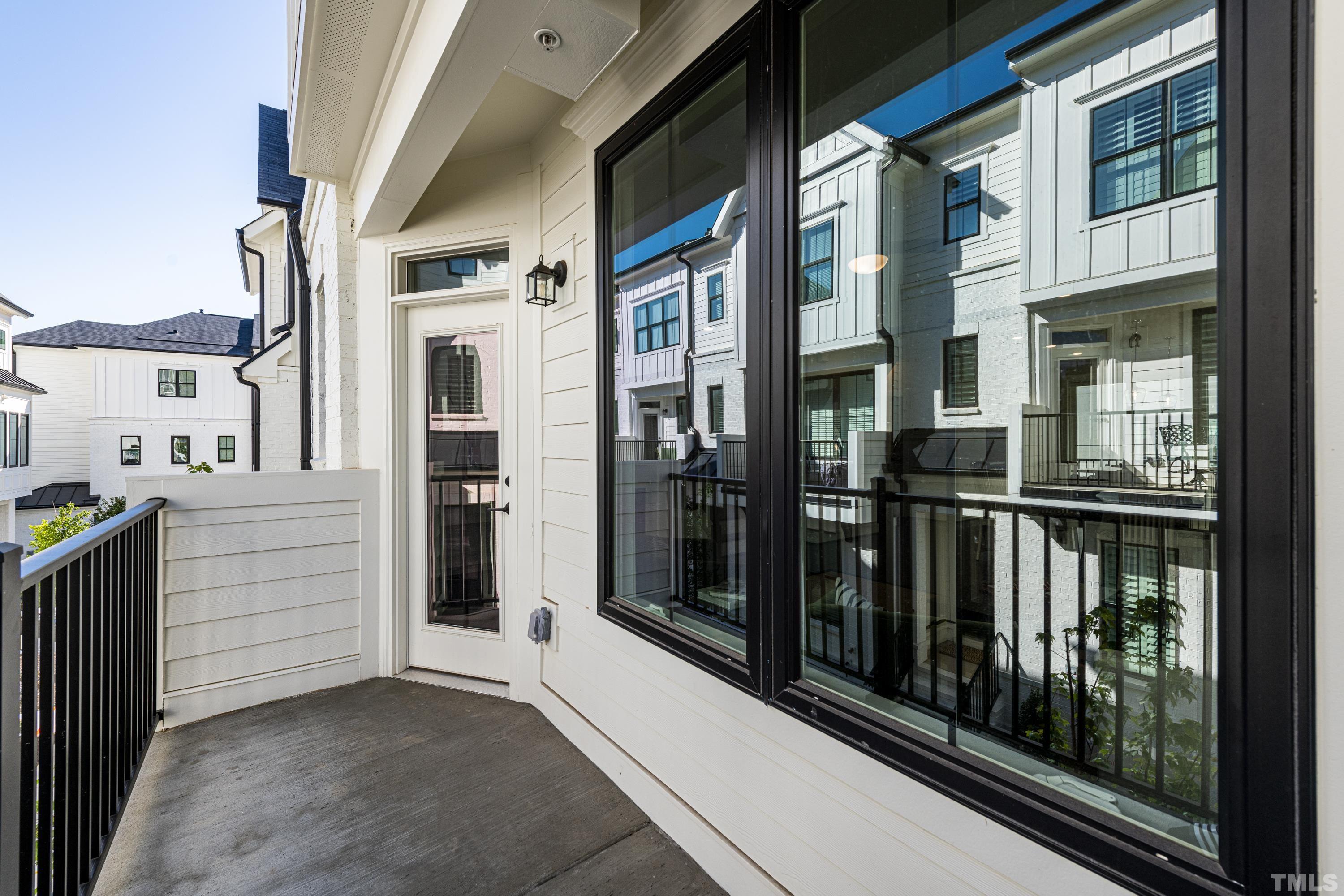 401 Bryan Pointe Drive, Unit 102 Raleigh, NC 27608 - Photo 19 of 30 a view of a balcony from a door