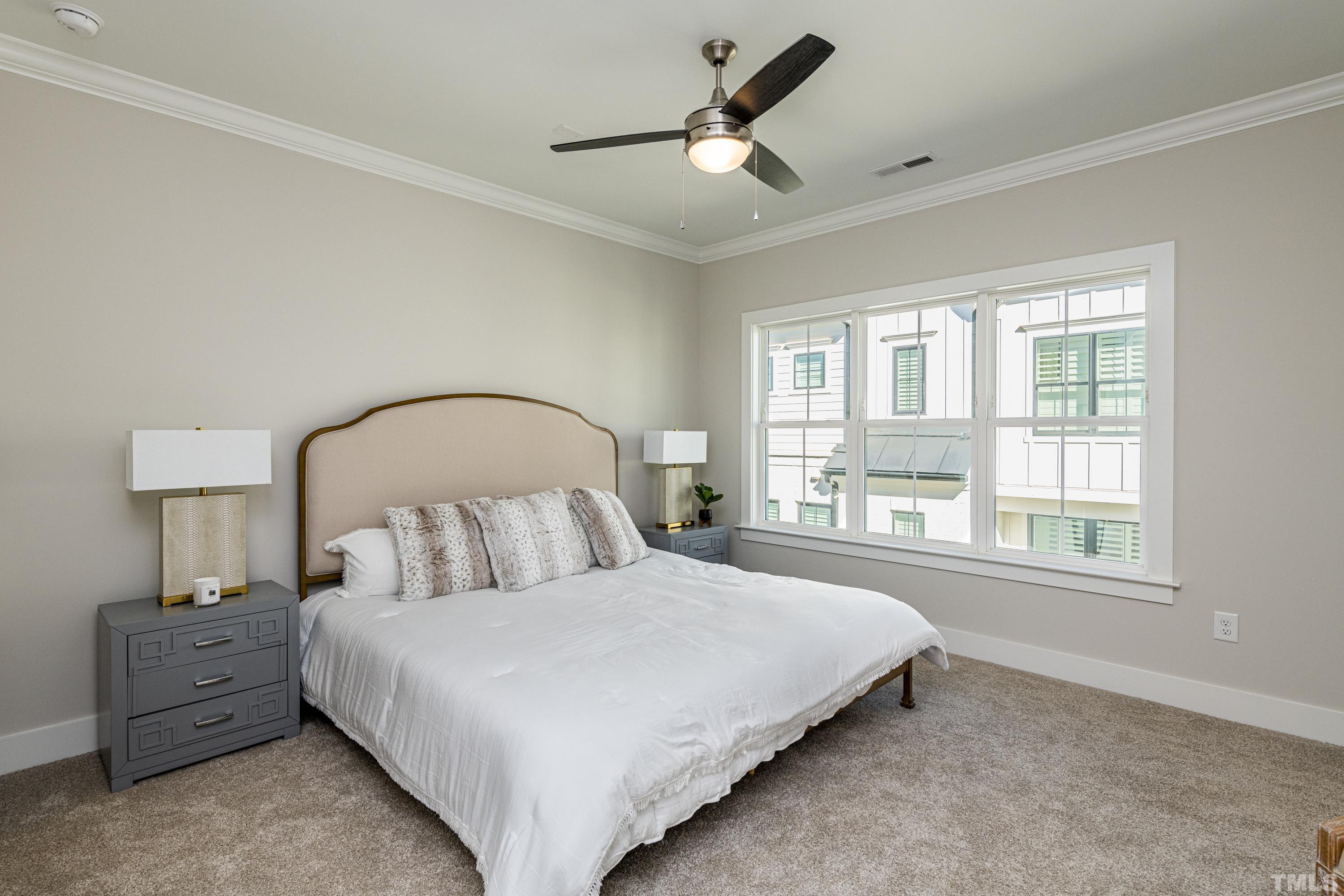 401 Bryan Pointe Drive, Unit 102 Raleigh, NC 27608 - Photo 20 of 30 a bedroom with a bed and a window