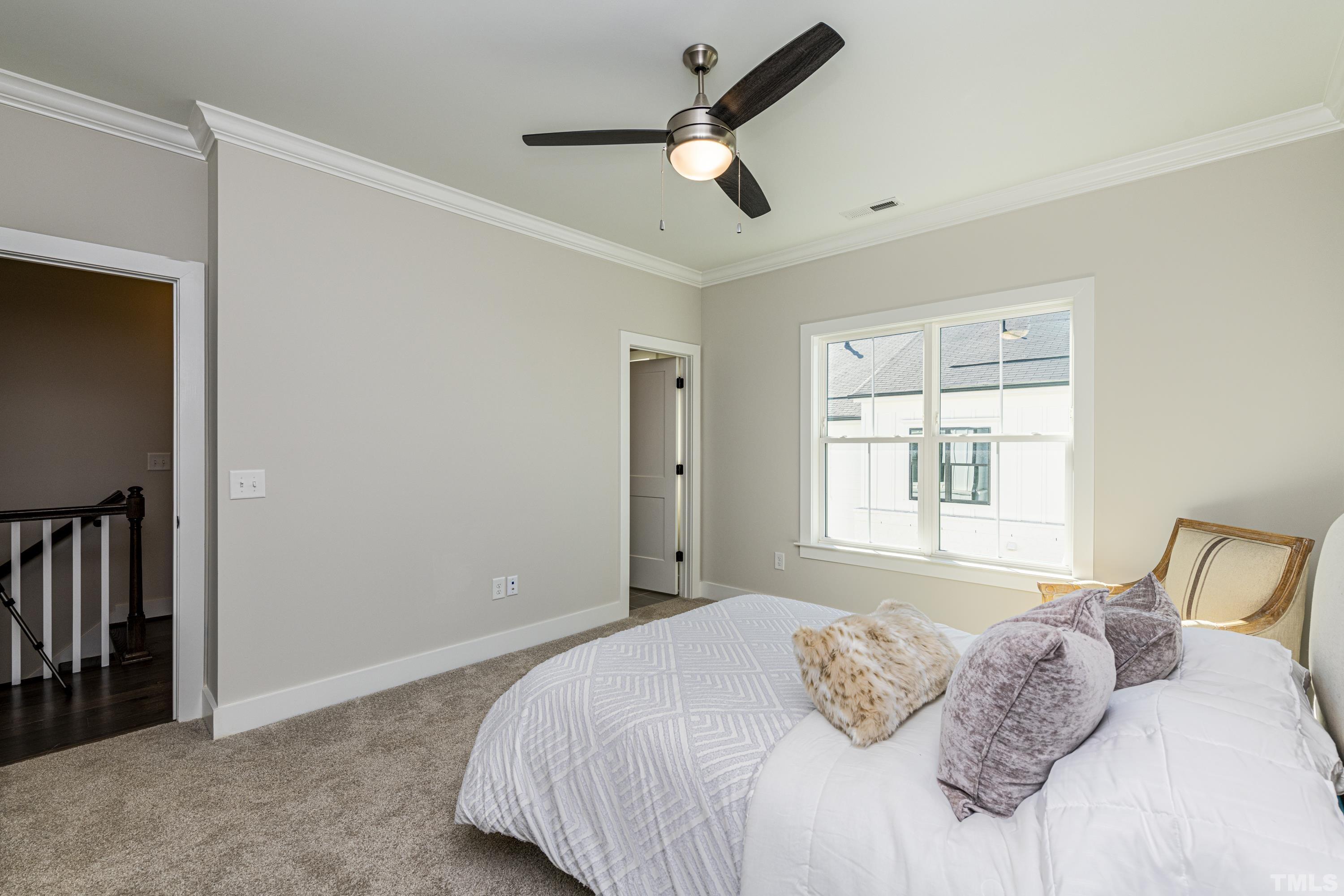 401 Bryan Pointe Drive, Unit 102 Raleigh, NC 27608 - Photo 26 of 30 a bedroom with a bed and a window