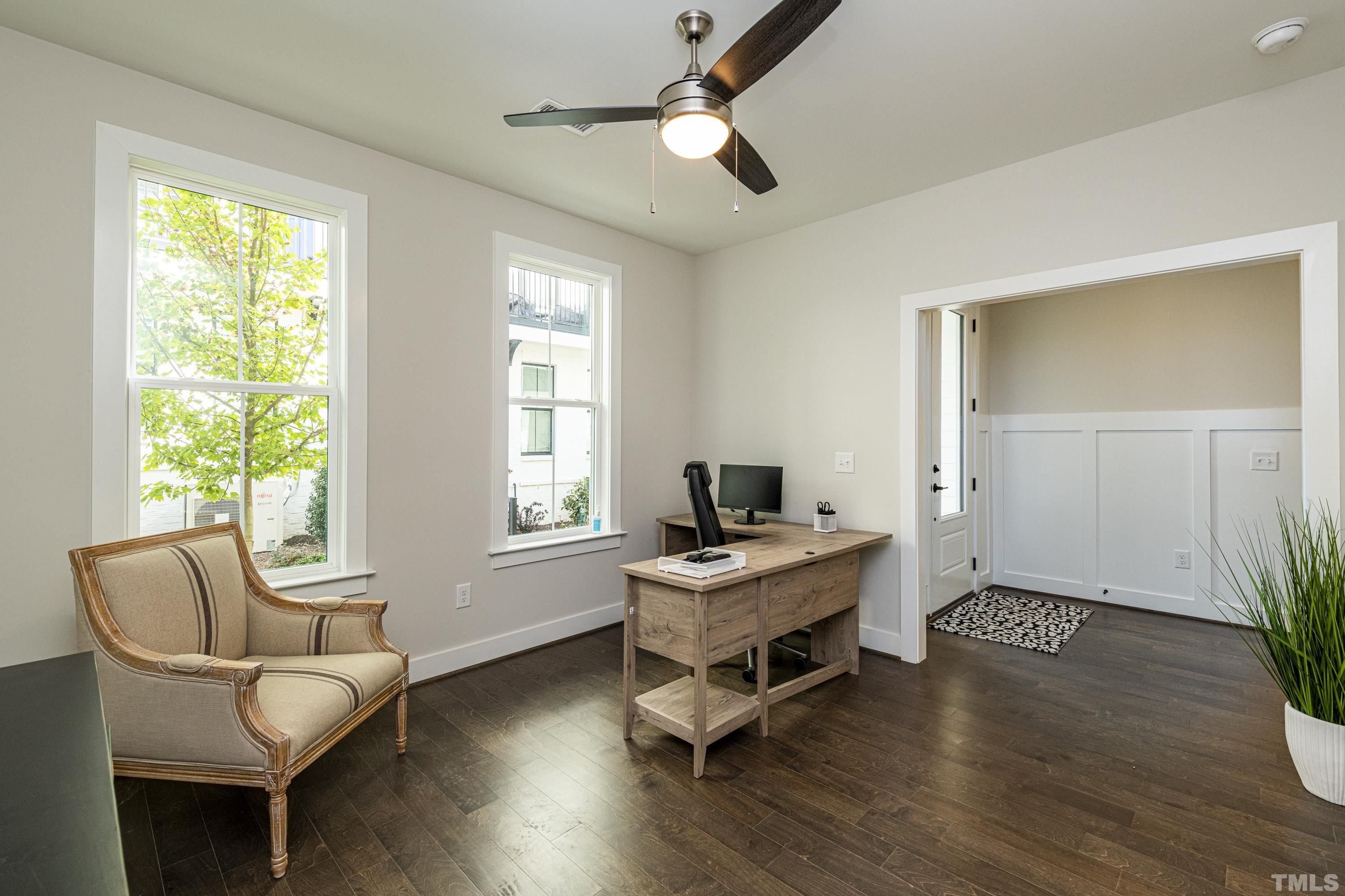 401 Bryan Pointe Drive, Unit 102 Raleigh, NC 27608 - Photo 5 of 30 a living room with furniture and a window