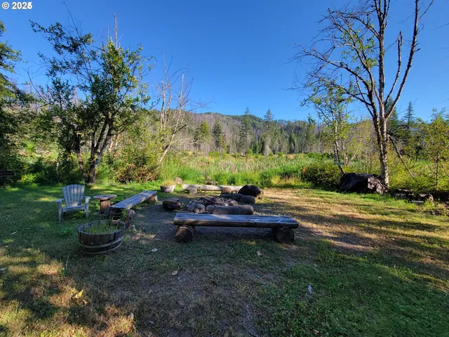 a view of a backyard with sitting area