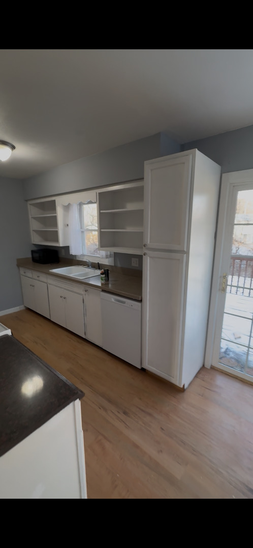 2919 Meadowbrook Drive Clinton, IA 52732 - Photo 2 of 12 a view of kitchen with furniture and wooden floor