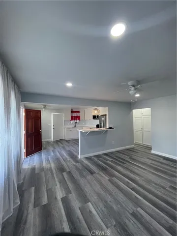 a view of a livingroom with wooden floor
