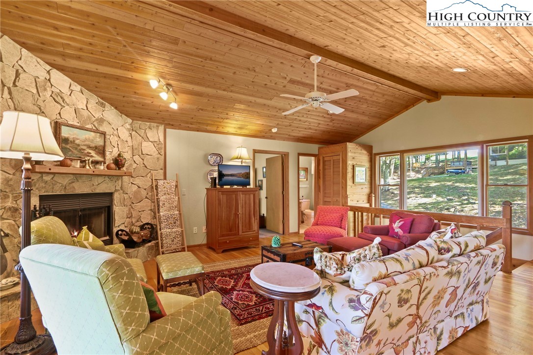 504 St Andrews Road Beech Mountain, NC 28604 - Photo 6 of 43 a living room with furniture and a fireplace
