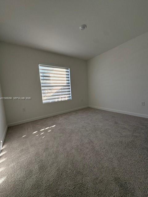 17435 Southwest 285th Street Homestead, FL 33033 - Photo 14 of 24 a view of an empty room with a window