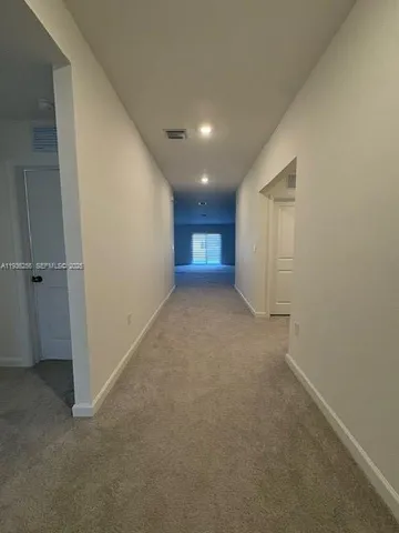 wooden floor and window in an empty room