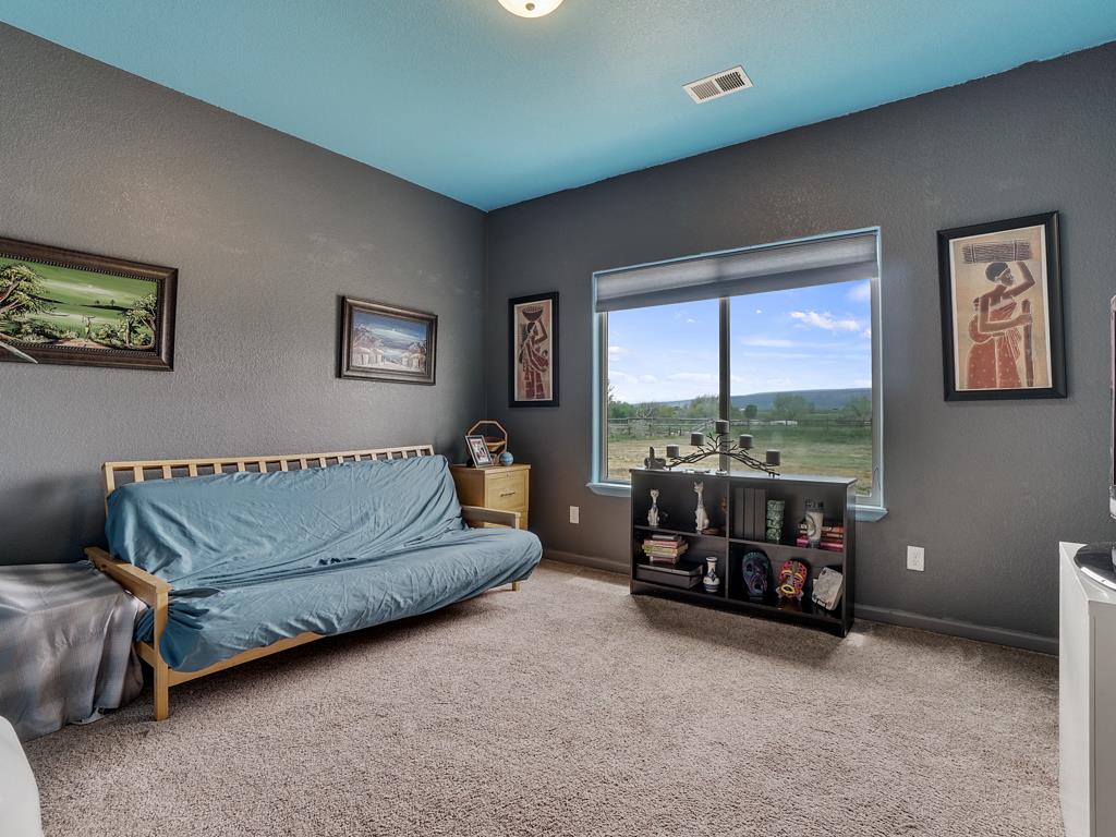 1853 Golden Ranch Road Fruita, CO 81521 - Photo 16 of 30 a living room with furniture and a large window