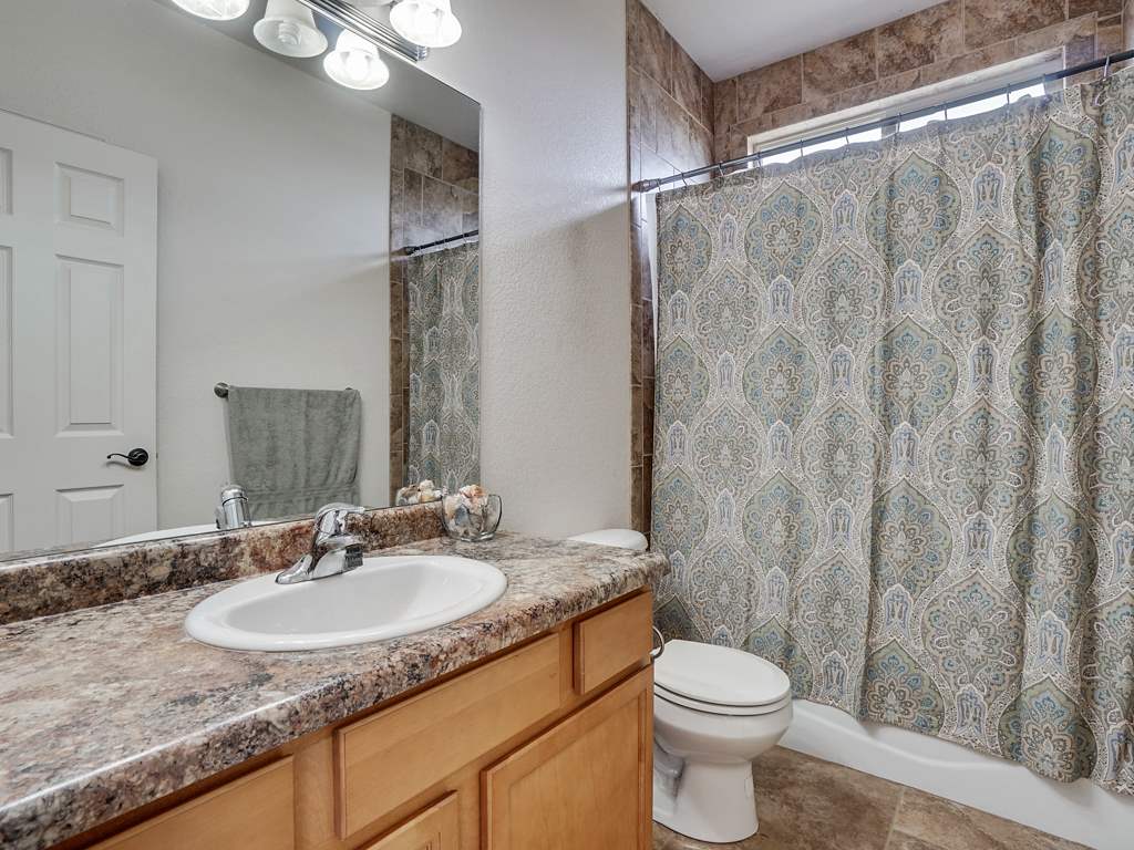 1853 Golden Ranch Road Fruita, CO 81521 - Photo 17 of 30 a bathroom with a granite countertop sink toilet and shower